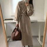 DERMEARNE French Lazy Style Warm Female Fresh Winter 2025 Classical Belt Retro Loose Women Woolen Coats Chic Casual Long Coat Long